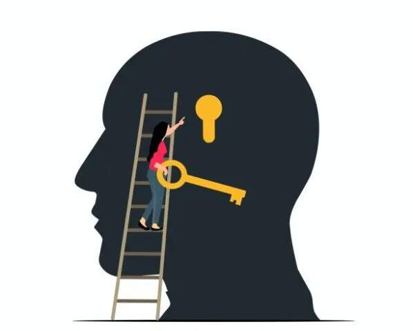 FIGURA EN NEGRO DE CABEZA DE SER HUMANO CON MUJER EN ESCALERA CON UNA LLAVE EN LA MANO PARA ABERIR LA CERRADURA QUE HAY EN LA CABEZA